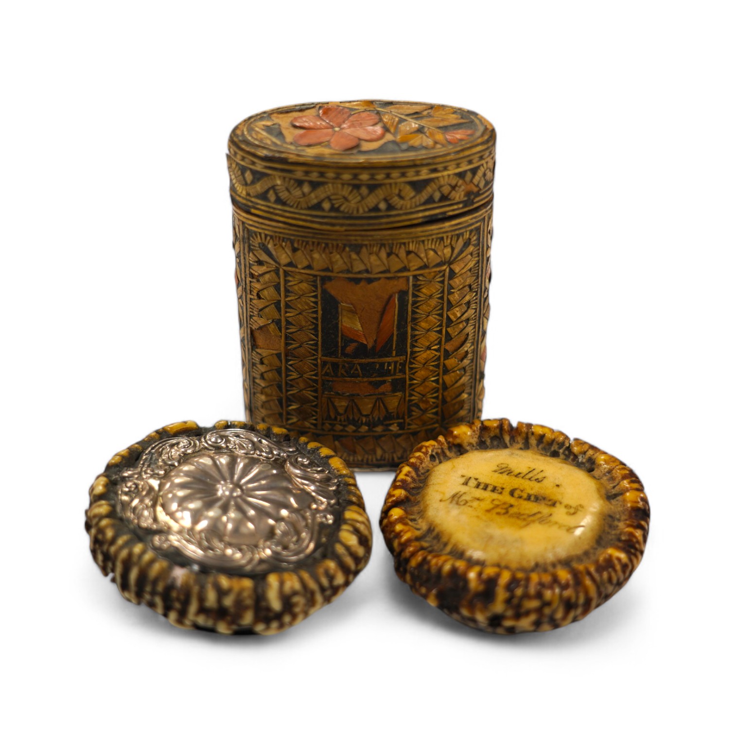 Two 19th century Scottish staghorn snuff boxes. one inscribed 'Mills, THE GIFT of Mr Bedford', with horn lid, 6.5cm, the other with white metal mounts, 6.5cm and a straw-work box, 8.5cm. Condition - staghorn boxes good,